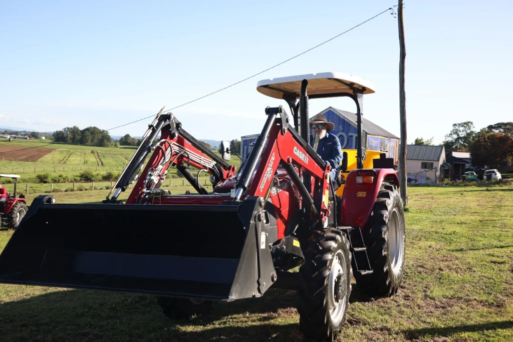 Case IH Farmall JXM tractor with Challenge Loader