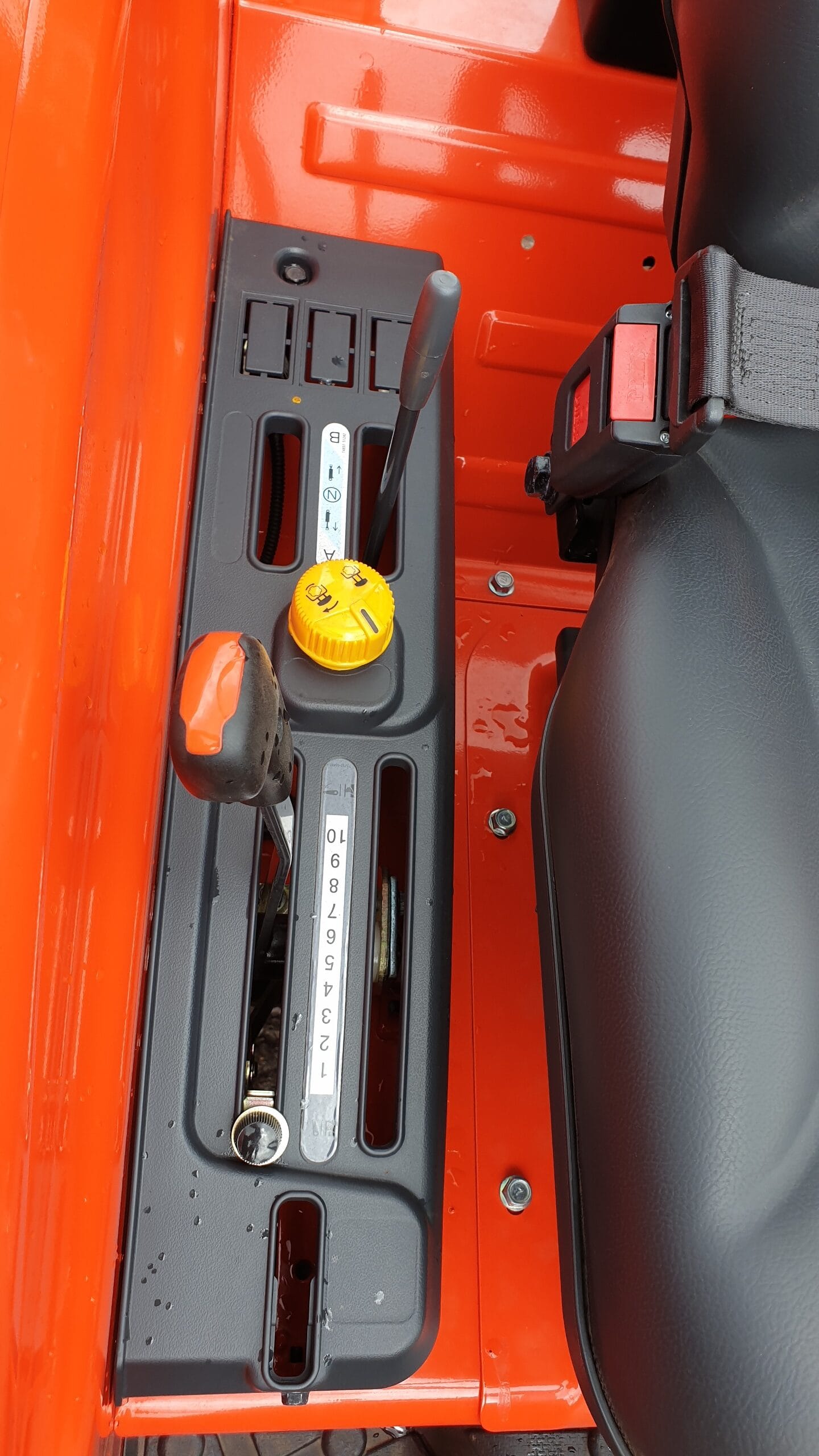Kioti DK4810 3 point linkage controls and PTO engage switch.