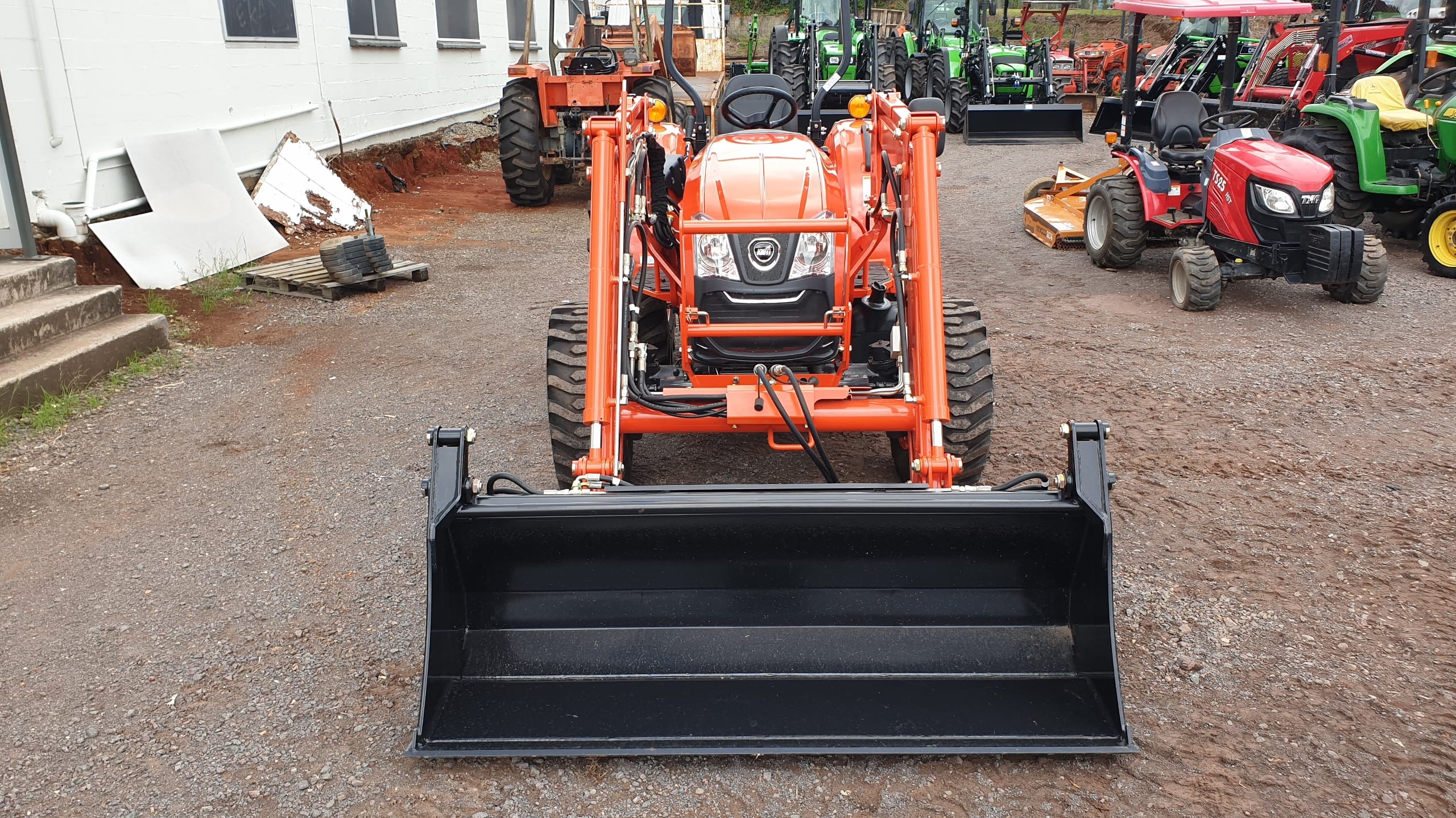 Kioti DK4810 front 4in1 bucket view looking back over the loader